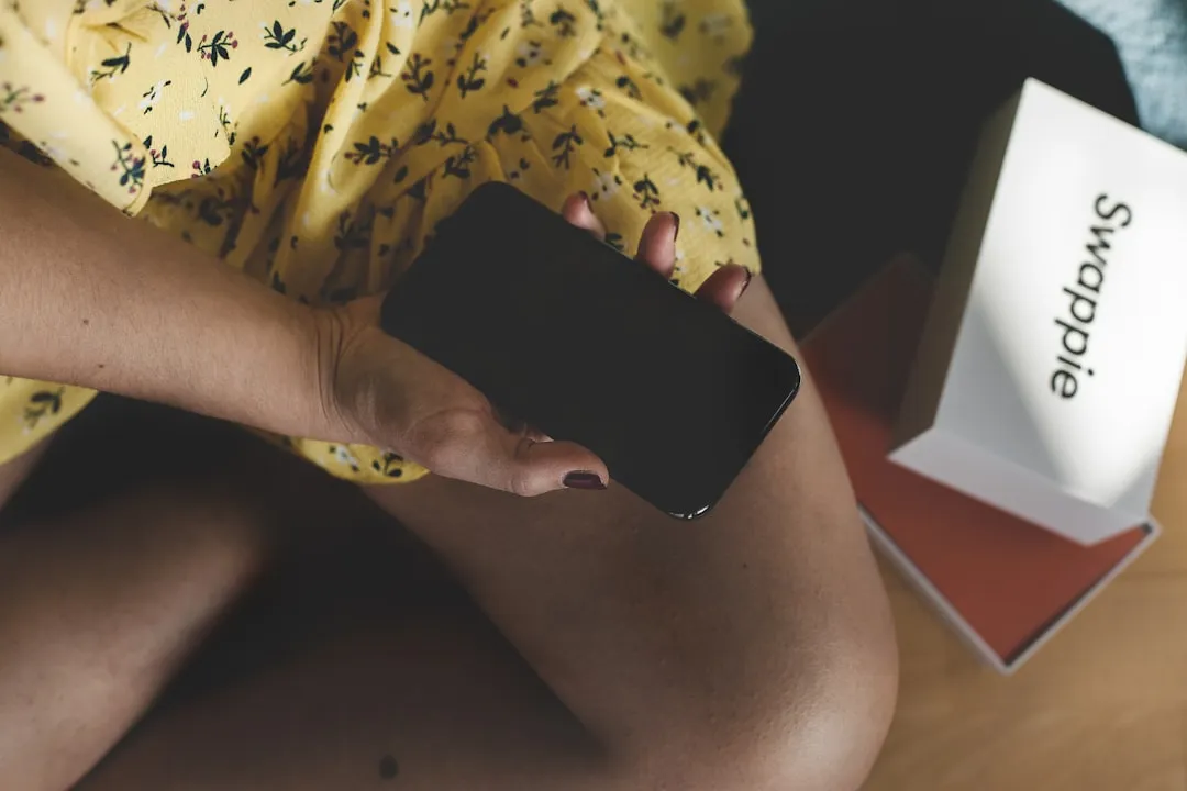 person holding black android smartphone