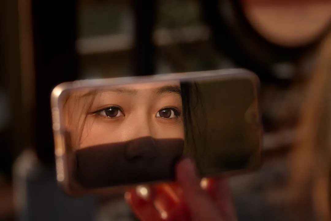 A woman looking at her reflection in a mirror