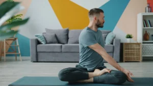 Man doing yoga in a living room