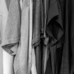 grayscale photography of assorted clothes
