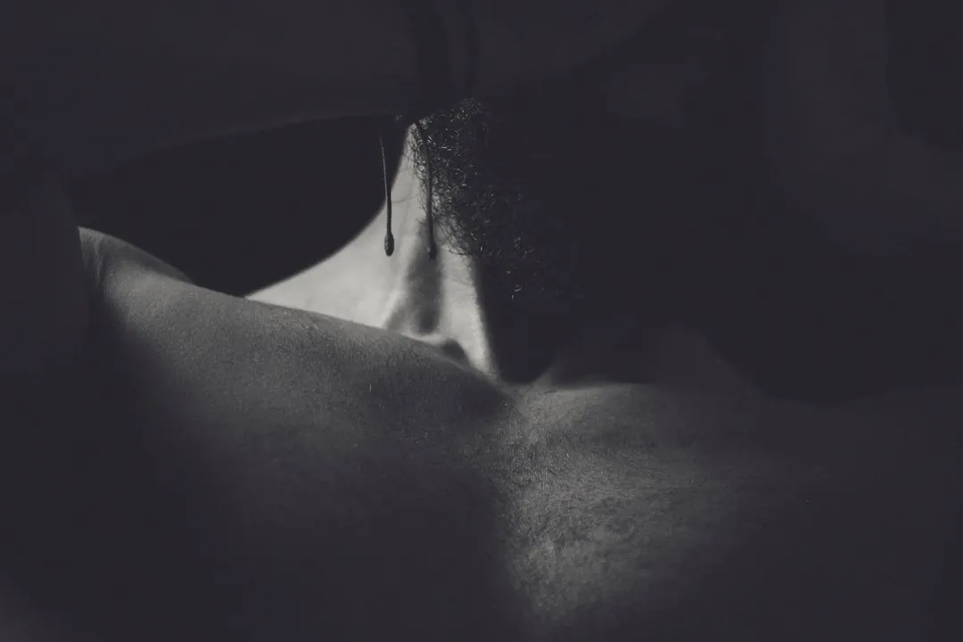 topless woman in black brassiere