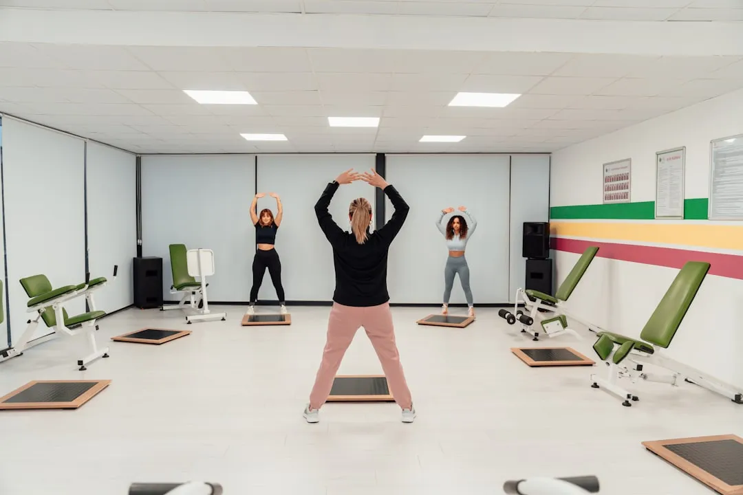 a group of people doing exercises in a room