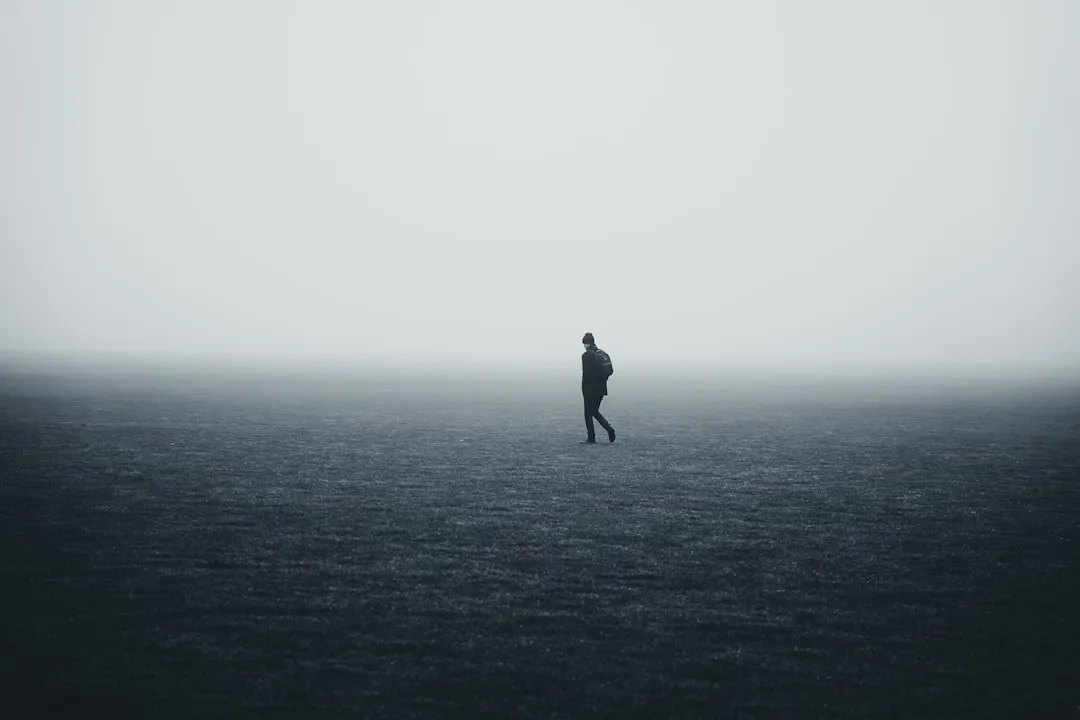 a person standing in the middle of a large body of water