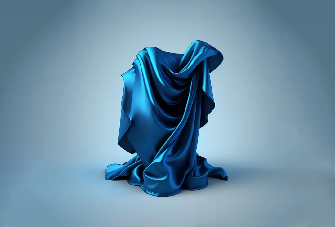 a blue cloth draped over a chair on a gray background