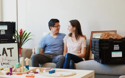 man and woman sitting on couch