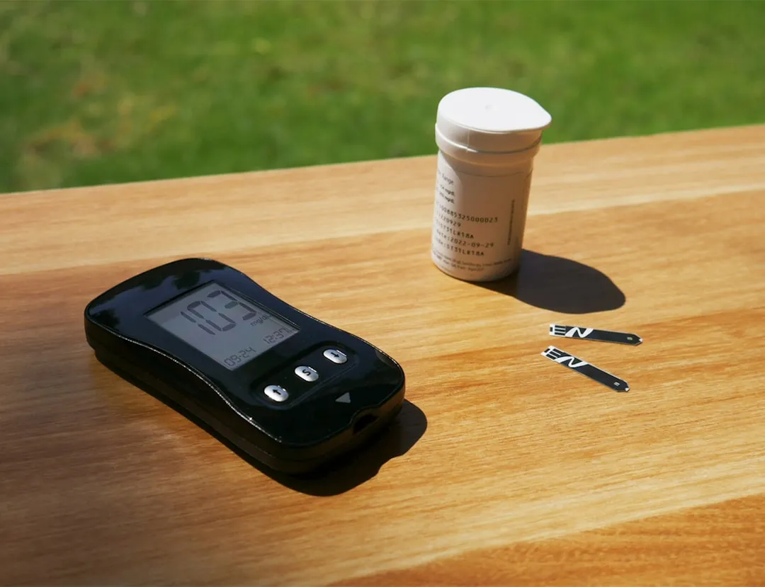 a cell phone sitting on top of a wooden table