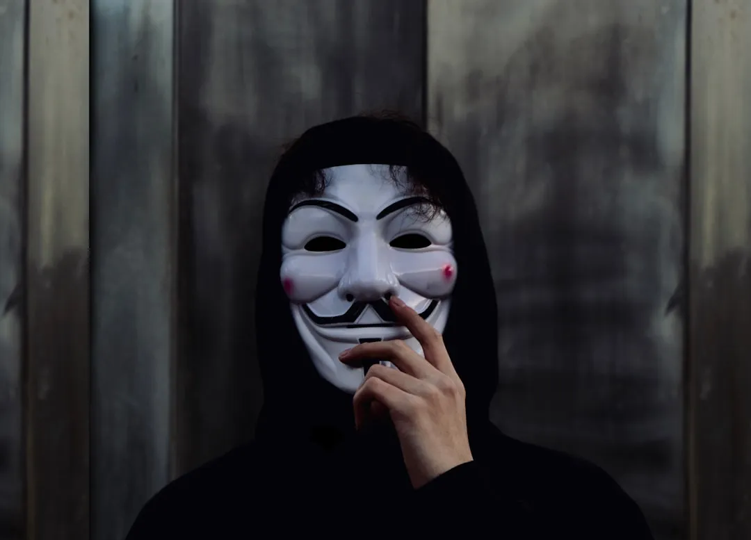 person wearing Guy Fawkes mask