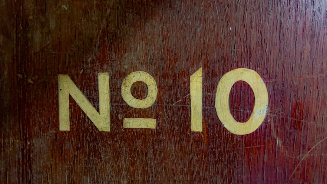 A close up of a wooden door with numbers on it