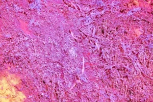 a pink and yellow background with a lot of dirt