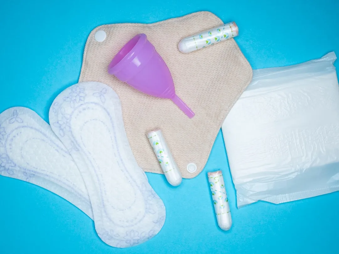 the contents of a diaper laid out on a blue surface