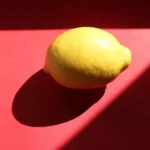 yellow lemon on purple textile