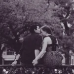 black and white photography of couple kissing forehead