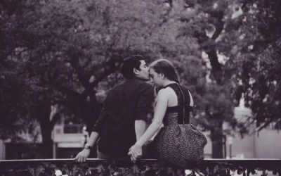 black and white photography of couple kissing forehead