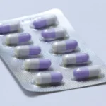 pink and white medication pill