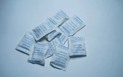 Small white packets with blue text on a light background