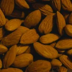 a pile of almonds sitting on top of a table