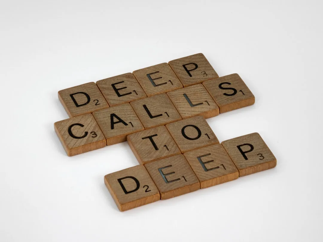 brown wooden puzzle blocks on white surface