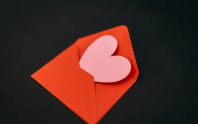a red envelope with a heart cut out of it