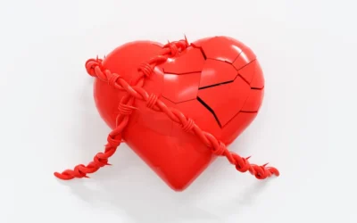 A broken red heart with a rope attached to it
