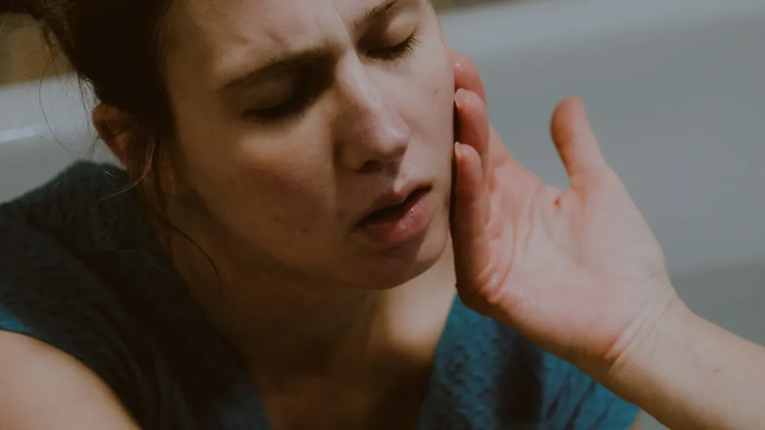 a woman holding her hand up