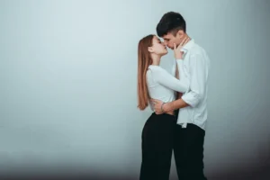 a man and woman kissing