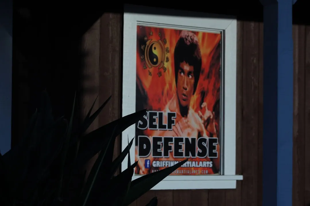 A movie poster hanging on the side of a building