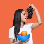 a person holding a bowl of fruit