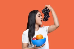 a person holding a bowl of fruit