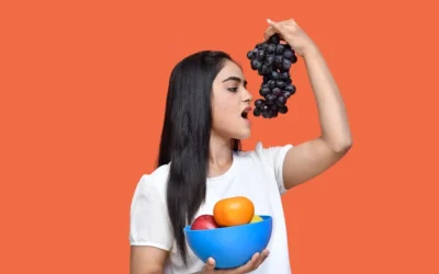 a person holding a bowl of fruit