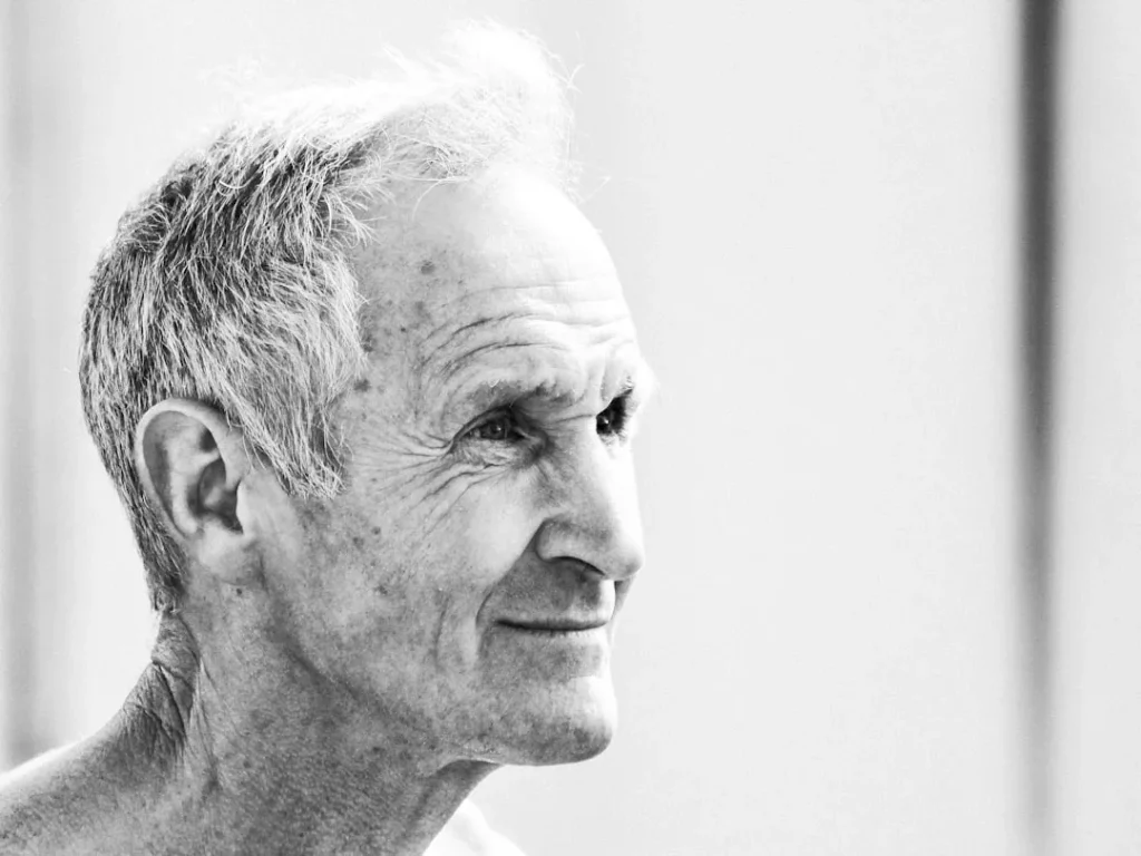 a black and white photo of an older man