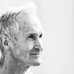 a black and white photo of an older man