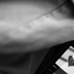 Smartphone screen displays a hand-drawn heart symbol.