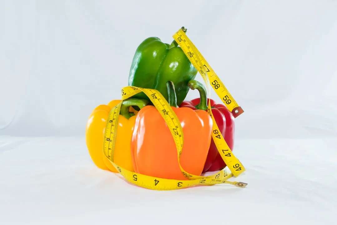 a measuring tape wrapped around peppers and peppers