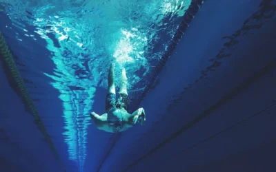 man swimming in swimming pool
