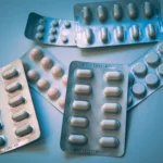 white and blue medication pill blister pack