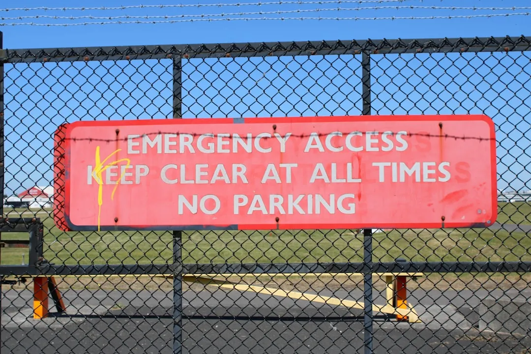 Emergency access sign warns "keep clear; no parking".