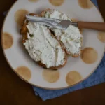 bread with white creme on plate