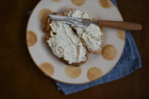bread with white creme on plate