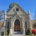 Gothic mausoleum with ornate doors and windows