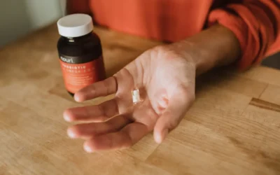 person holding medication pill