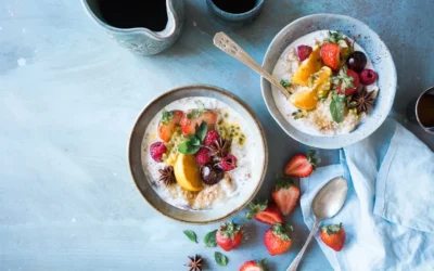two bowls of oatmeal with fruits