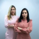 a couple of women standing next to each other