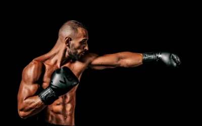 a man with a bald head wearing boxing gloves