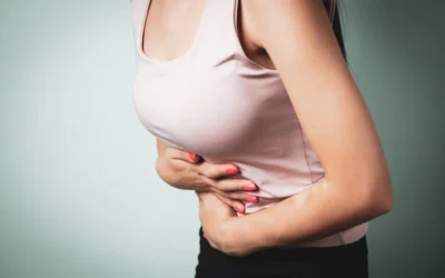A person holding their stomach in pain.