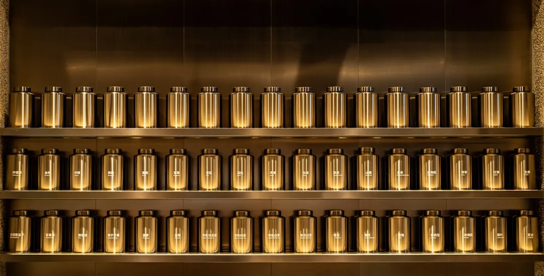a metal shelf filled with lots of bottles